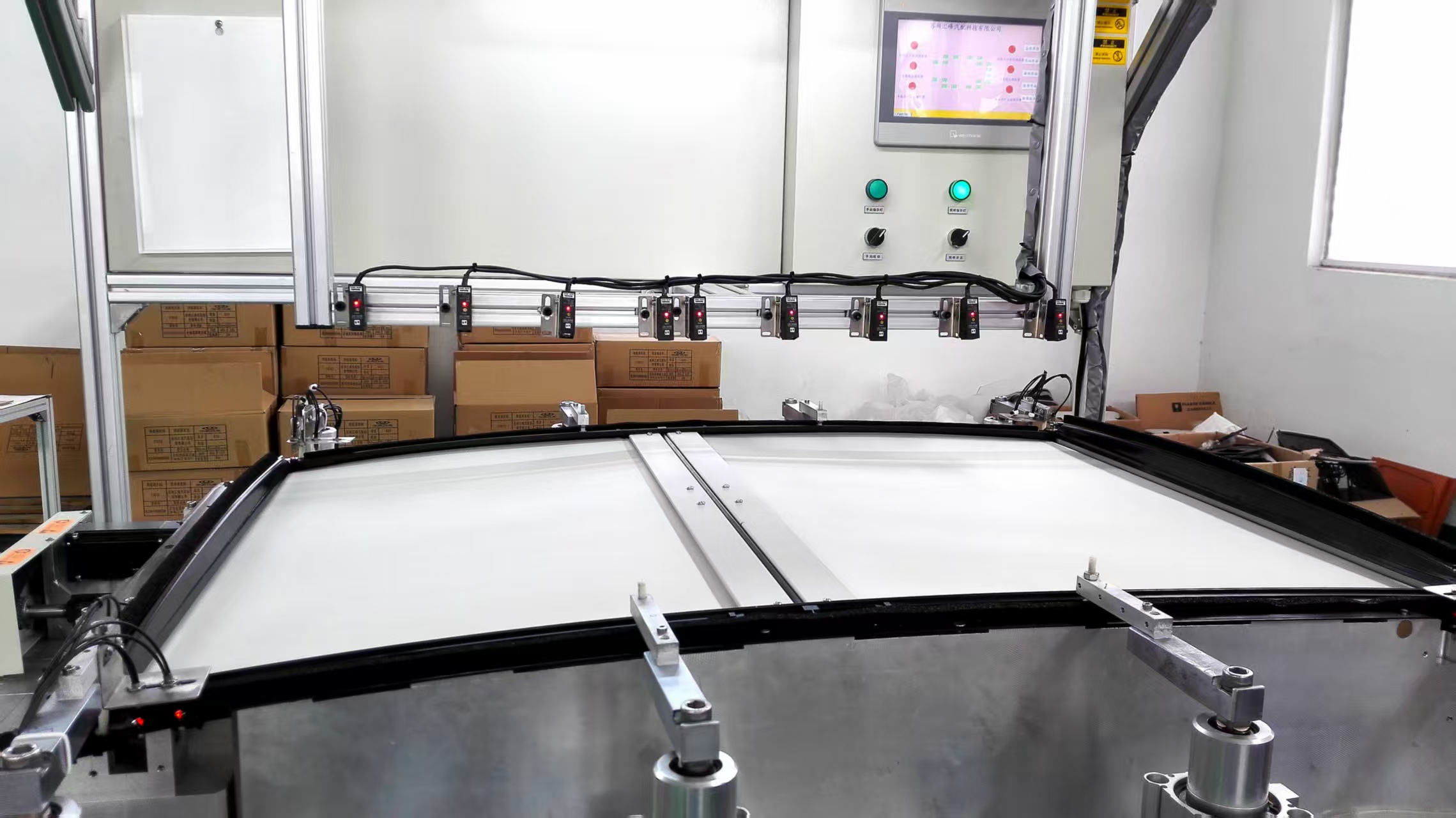 汽车遮阳帘自动贴合机